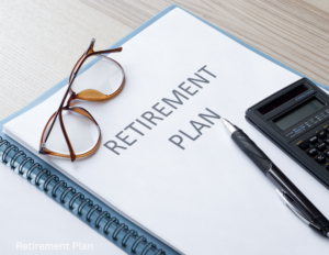 Retirement plan folder with glasses and calculator